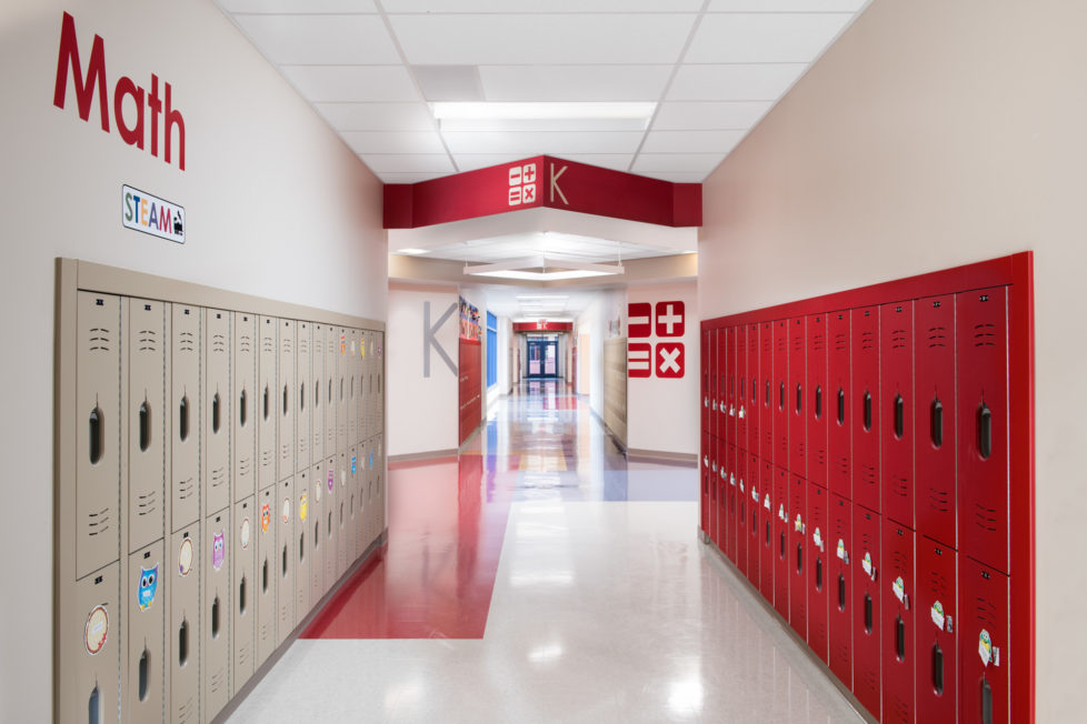 Kindergarten Math hallway at Northwest Elementary School at STEAM school, red lockers, large graphics of math symbols and the word "Math" on walls